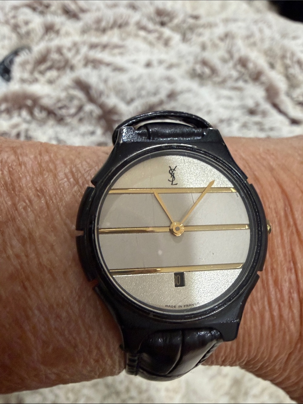 Yves Saint Laurent Black Leather Watch with Gold Accents and Silver Dial